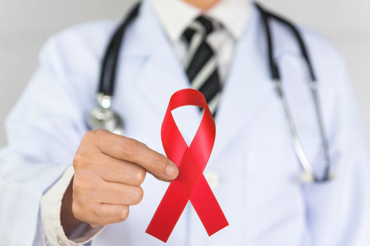 A doctor holding red cross ribbon to promote stroke awareness among people.